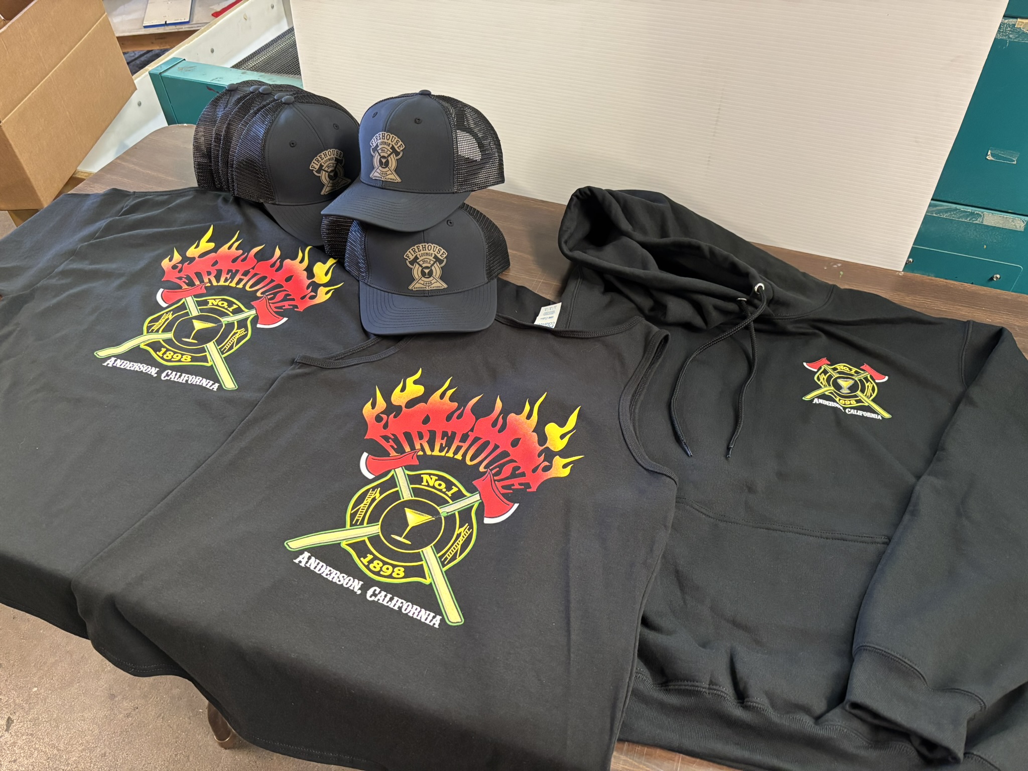 Screen-printed shirts and caps for Firehouse Lounge in Anderson